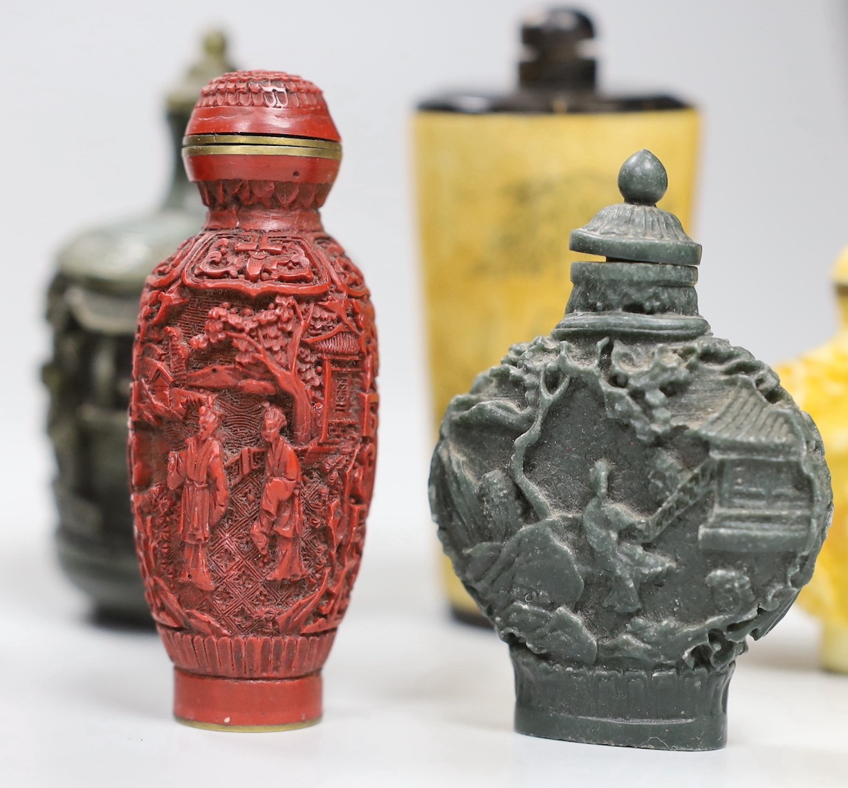 A collection of moulded resin snuff bottles